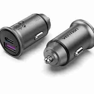 Vention VEN-QC67-UK-B gray car charger with two USB-A ports inserted into a vehicle socket Close-up of the charger’s aluminum-alloy body and gold-plated USB connector Side view showing the compact mini-style design and PVC jacket cable Detail of USB-A port labels “5V⎓5A / 9V⎓3A / 12V⎓2.5A” on the charger body Vention car charger plugged into a car dashboard charging a smartphone via USB-C Top-down shot of the dual-port charger removed from the socket, highlighting its slim profile