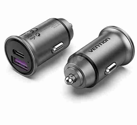 Vention VEN-QC67-UK-B gray car charger with two USB-A ports inserted into a vehicle socket Close-up of the charger’s aluminum-alloy body and gold-plated USB connector Side view showing the compact mini-style design and PVC jacket cable Detail of USB-A port labels “5V⎓5A / 9V⎓3A / 12V⎓2.5A” on the charger body Vention car charger plugged into a car dashboard charging a smartphone via USB-C Top-down shot of the dual-port charger removed from the socket, highlighting its slim profile