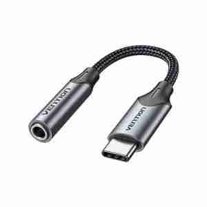 Vention BGMHA USB-C to 3.5 mm adapter cable showing gray aluminum alloy housing Close-up of gold-plated USB-C connector and 3.5 mm jack on the Vention adapter Vention DAC adapter plugged into a Pixel smartphone with earphones attached Side profile of the slim 0.1 m Vention audio adapter against a white background Vention audio adapter alongside a pair of 3.5 mm headphones and USB-C laptop port Cable shot highlighting the braided PVC jacket and aluminum housing of the adapter