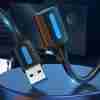 Vention CBHBI USB 3.0 extension cable showing male Type-A connector plugged into a laptop Close-up of gold-plated USB-A male and female connectors on the Vention cable Coiled 3 m black USB 3.0 extension cable with dual ferrite cores visible under PVC jacket Vention extension cable connecting an external hard drive to a desktop PC Side view of USB 3.0 cable highlighting sturdy PVC outer jacket and braided shielding Vention CBHBI cable laid out straight on a desk with a keyboard and mouse attached
