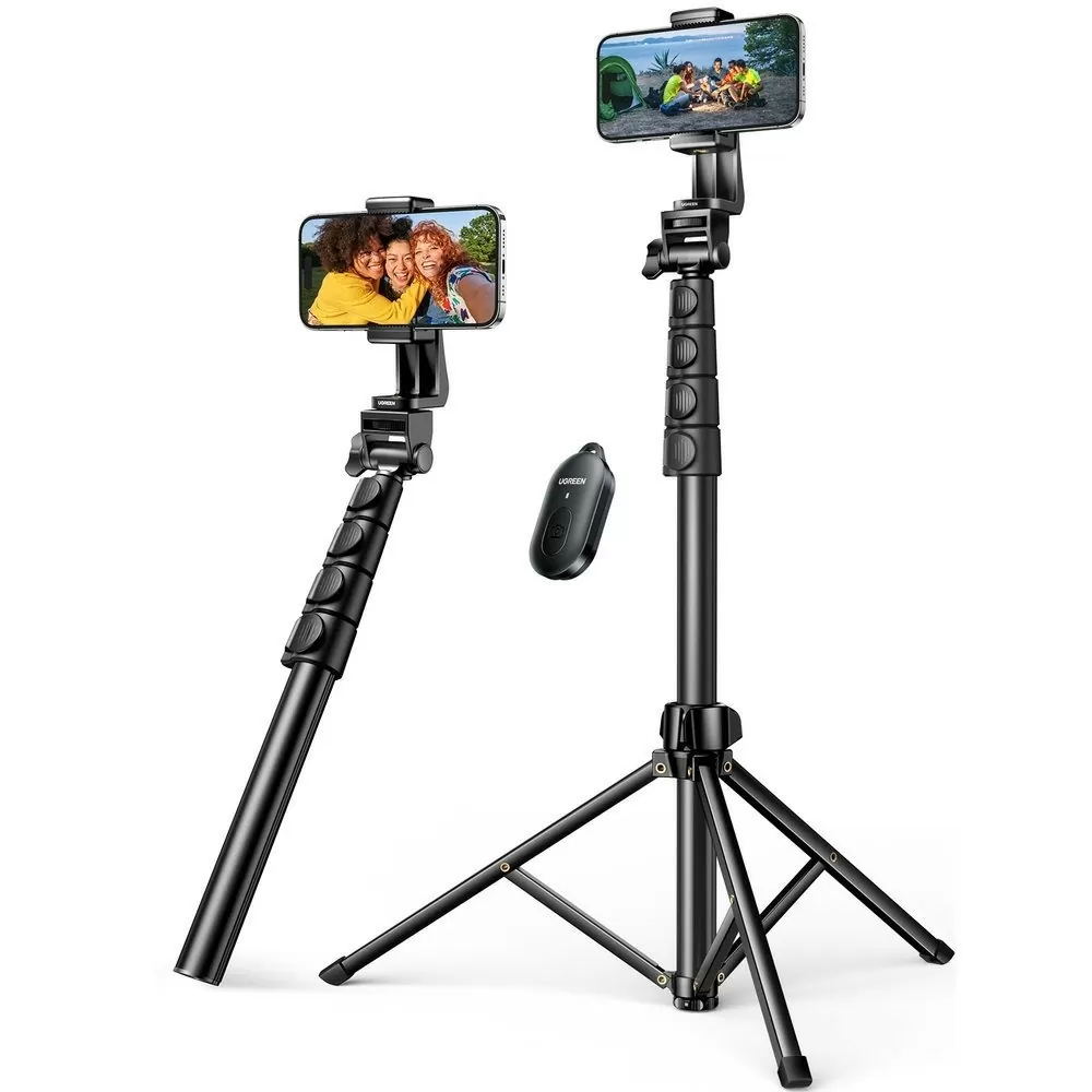 "Ugreen LP586 selfie stick tripod extended with phone mounted" "Folded Ugreen LP586 selfie stick showing compact travel size" "Detachable Bluetooth remote control from Ugreen LP586 tripod" "Close-up view of anti-slip tripod legs on Ugreen LP586" "Smartphone in vertical position on Ugreen LP586 phone holder" "User taking group selfie using Ugreen LP586 tripod with remote"