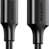 UGREEN US287 USB 3.0 to USB-C cable coiled with connectors visible Close-up of nickel-plated USB Type-A and Type-C connectors UGREEN 2m USB-C cable plugged into a laptop and smartphone Black UGREEN US287 cable laid out on a desk with accessories Durable UGREEN cable showing bend resistance and build quality Packaging of UGREEN US287 USB-C cable with branding visible