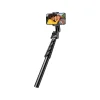 "Ugreen LP680 selfie stick tripod with phone attached and Bluetooth remote" "Folded Ugreen LP680 tripod in compact travel-friendly form" "Close-up of detachable Bluetooth remote on Ugreen selfie stick" "Ugreen LP680 used as tripod stand for smartphone" "Adjustable selfie stick extended with anti-slip grip handle" "Portable black Ugreen selfie stick tripod on white background"