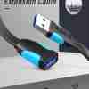 Vention CBHBG USB 3.0 extension cable with male and female Type-A connectors on a white background Close-up of the gold-plated USB 3.0 Type-A male plug and PVC-jacketed cable Female USB-A port of the Vention extension cable connected to an external hard drive Full 1.5 m length of the Vention CBHBG cable coiled neatly on a desk next to a laptop Dual ferrite cores visible under the PVC jacket near the male connector end Vention cable in use, extending a keyboard’s USB connection to a desktop PC