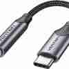 Vention BGMHA USB-C to 3.5 mm adapter cable showing gray aluminum alloy housing Close-up of gold-plated USB-C connector and 3.5 mm jack on the Vention adapter Vention DAC adapter plugged into a Pixel smartphone with earphones attached Side profile of the slim 0.1 m Vention audio adapter against a white background Vention audio adapter alongside a pair of 3.5 mm headphones and USB-C laptop port Cable shot highlighting the braided PVC jacket and aluminum housing of the adapter