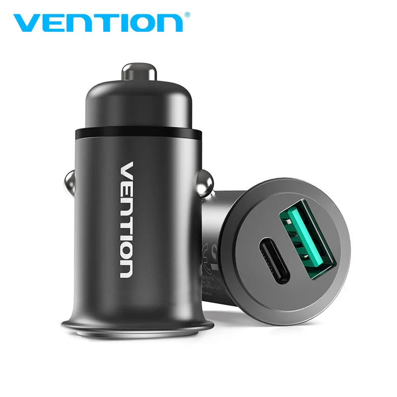 Vention VEN-QC67-UK-B gray car charger with two USB-A ports inserted into a vehicle socket Close-up of the charger’s aluminum-alloy body and gold-plated USB connector Side view showing the compact mini-style design and PVC jacket cable Detail of USB-A port labels “5V⎓5A / 9V⎓3A / 12V⎓2.5A” on the charger body Vention car charger plugged into a car dashboard charging a smartphone via USB-C Top-down shot of the dual-port charger removed from the socket, highlighting its slim profile