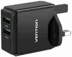 Vention VEN-QC67-UK-B black wall charger plugged into a UK-style power socket Close-up of the charger’s aluminum-alloy casing and USB-A/USB-C ports Side view showing “USB-A 18W” and “USB-C 20W” labels on the charger body Vention wall charger attached to a power strip with a USB-C cable connected to a smartphone Compact charger next to a travel bag and other travel gadgets on a desk Angle shot highlighting the slim profile and matte finish of the VEN-QC67-UK-B charger