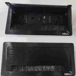 Nexa black multifunction pop-up socket front view Flip-up Nexa power and data socket with ports Nexa desktop socket with HDMI, USB, VGA in black Closed Nexa flip-up unit in black aluminum finish Nexa pop-up conference table socket with universal outlets Workspace setup featuring Nexa black tabletop socket