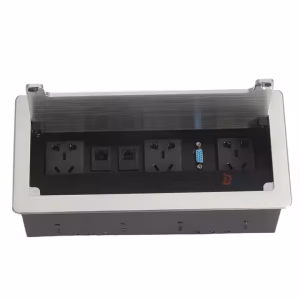 Nexa silver flip-up socket with ports exposed Closed Nexa flip-up socket showing sleek finish Nexa flip-up socket with HDMI, VGA, USB, and power outlets Premium aluminum desk socket in silver Nexa conference socket with 3.5mm and CAT6 port Flip-up power and AV connectivity box for modern workspaces