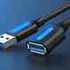 Vention CBHBF 1M USB 3.0 cable with A male and A female connectors Vention USB 3.0 extension cable black 1 meter coiled Close-up of nickel-plated USB connectors on CBHBF cable Dual shielded structure USB cable side view Vention USB A to A 3.0 extension cable plugged into laptop Packaging and layout of Vention CBHBF cable