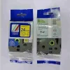 Compatible Brother TZ2-651 black on yellow 24mm label tape roll Brother P-Touch printer with 24mm yellow label installed Sample label printed with black on yellow TZ2-651 tape Compatible TZ2-651 label applied to warehouse shelf Close-up of laminated yellow label on electrical cable Packaging of Brother TZ2-651 compatible 24mm label tape Brother P-Touch printer with 24mm yellow label installed Sample label printed with black on yellow TZ2-651 tape Compatible TZ2-651 label applied to warehouse shelf Close-up of laminated yellow label on electrical cable Packaging of Brother TZ2-651 compatible 24mm label tape