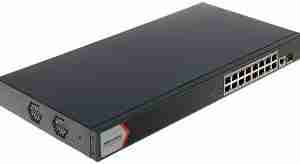Front view of Hikvision DS‑3E1518P‑EI/M showing 16 PoE ports Rear panel highlighting SFP slot and uplink port Rugged metal chassis design of Hikvision switch LED status indicators for PoE and link activity Diagram of switch powering IP cameras with 300 m reach Rack-mounted setup of Hikvision DS‑3E1518P‑EI/M