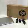 HP ProBook 450 G10 front view with screen on HP 822P5UT slim side profile with visible USB and HDMI ports Backlit keyboard and numeric keypad close-up Pike Silver finish with HP logo HP ProBook 450 G10 open with Windows 11 screen Top-down angle showing full-size keyboard and touchpad