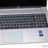 HP ProBook 450 G10 front view with display on Side profile showing ports and slim design Backlit keyboard close-up Top view highlighting the touchpad and keyboard layout Pike Silver finish showcasing the laptop's sleek design HP ProBook 450 G10 open at a 90-degree angle