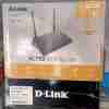 D-Link DIR-806A dual-band router front view AC750 Wi-Fi router with three antennas Rear port view of DIR-806A Wi-Fi coverage area of DIR-806A D-Link router in home environment Product box and accessories of DIR-806A