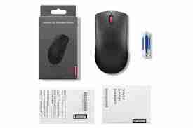 Top view of Lenovo 150 Wireless Mouse in black color. Side profile showcasing the ergonomic design of the Lenovo 150 Wireless Mouse. Bottom view highlighting the optical sensor and battery compartment. Lenovo 150 Wireless Mouse connected via USB-A nano receiver. Packaging contents including mouse, USB receiver, and AA battery. Lenovo 150 Wireless Mouse in use with a laptop setup