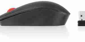 Top view of Lenovo ThinkPad Essential Wireless Mouse in black color. Side profile showcasing the ergonomic design of the Lenovo ThinkPad Essential Wireless Mouse. Bottom view highlighting the optical sensor and battery compartment. Lenovo ThinkPad Essential Wireless Mouse connected via Nano USB receiver. Packaging contents including mouse, USB receiver, and AA battery. Lenovo ThinkPad Essential Wireless Mouse in use with a laptop setup.