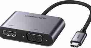 UGREEN CM162 4-in-1 USB-C adapter showing HDMI, VGA, USB-A, and USB-C ports Close-up view of USB-C input cable and sleek aluminum finish Adapter connected to a laptop with HDMI and USB in use Side angle showing all available ports Top-down view highlighting compact size and layout Product with packaging showing model number and specifications