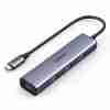 UGREEN CM473 USB-C Hub with 4 ports shown in front view Top view of hub showing port layout Side profile of hub with aluminum casing CM473 hub connected to a laptop with devices attached Close-up of USB-A and USB-C ports Packaging view of UGREEN CM473 model 20841