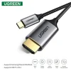 UGREEN MM142 USB-C to HDMI Cable 1.5M in black Close-up of USB-C male and HDMI male connectors UGREEN MM142 connected from laptop to 4K monitor HDMI end of UGREEN Type-C 1.5m cable plugged into TV UGREEN cable used for screen mirroring from MacBook Packaging of UGREEN MM142 USB-C to HDMI 4K cable