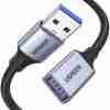 UGREEN US115 5M USB 3.0 extension cable rolled up Close-up of USB-A male and female ends of UGREEN cable UGREEN 5M USB extension cable connected to external hard drive USB 3.0 extender cable for webcam setup Gold-plated connectors of UGREEN US115 extension cable Retail packaging for UGREEN USB 3.0 extension cable model 25285
