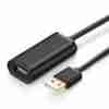 UGREEN US121 10M USB extension cable coiled with male and female ends Close-up of UGREEN USB 2.0 active cable showing built-in chipset UGREEN 10321 in use connecting a webcam to a distant laptop USB-A male connector and female port on 10-meter UGREEN cable Packaging for UGREEN US121 active USB extension cable Extended workspace setup using UGREEN 10M USB cable