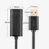 UGREEN US121 10M USB extension cable coiled with male and female ends Close-up of UGREEN USB 2.0 active cable showing built-in chipset UGREEN 10321 in use connecting a webcam to a distant laptop USB-A male connector and female port on 10-meter UGREEN cable Packaging for UGREEN US121 active USB extension cable Extended workspace setup using UGREEN 10M USB cable