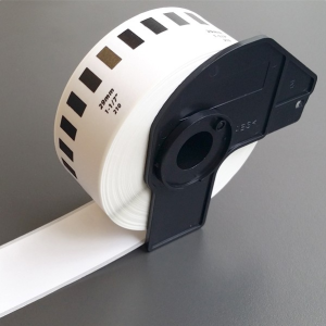 Brother DK-22210 continuous paper label roll front view Brother DK-22210 label roll 29mm width black on white Brother DK-22210 installed in Brother QL label printer Continuous label roll DK-22210 being cut to custom length Brother DK-22210 label roll packaging view Printed address label using Brother DK-22210 continuous roll