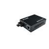 D-Link DMC-540SSC fiber media converter front panel view D-Link DMC-540SSC showing RJ-45 and SC fiber ports D-Link DMC-540SSC compact metal housing side view Fiber cable connected to D-Link DMC-540SSC SC port LED indicators on D-Link DMC-540SSC during operation D-Link DMC-540SSC installed in network rack or chassis
