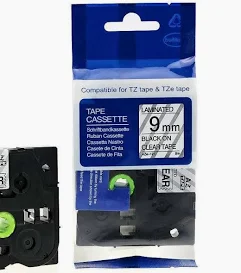 Brother TZC-S121 9mm black on clear label cartridge Compatible laminated label tape for Brother printers Clear label tape with black print 9mm labeling tape cartridge close-up Label tape installed in printer Durable laminated label for office use
