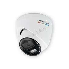 Hikvision 4MP ColorVu turret camera mounted on exterior wall Smart hybrid light CCTV camera with color night vision active Hikvision turret camera with siren and flashing strobe light Close-up of lens and built-in microphone speaker system Outdoor IP67 waterproof Hikvision security camera in rain Full-color night surveillance footage from Hikvision ColorVu camera