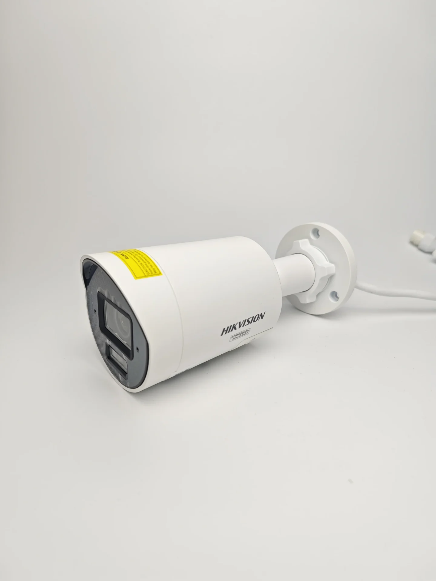 Hikvision 4MP mini bullet ColorVu camera front view DS-2CD2047G3-LI2UY outdoor wall installation Smart hybrid light full color night surveillance example Hikvision 4mm lens long range monitoring camera Weatherproof IP67 bullet camera security setup Hikvision mini bullet camera side angle design